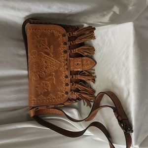Embossed brown leather Patricia Nash bag with tassles